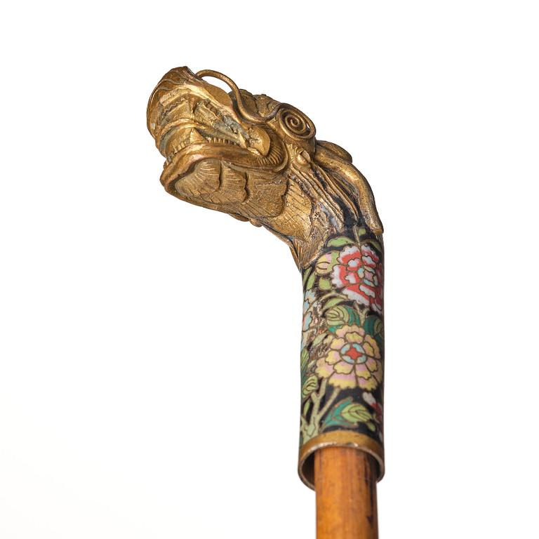 A Chinese bamboo walking cane with a cloisonné handle, late Qing dynasty/early 20th Century.