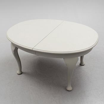 A painted Rococo style dining table, circa 1900.