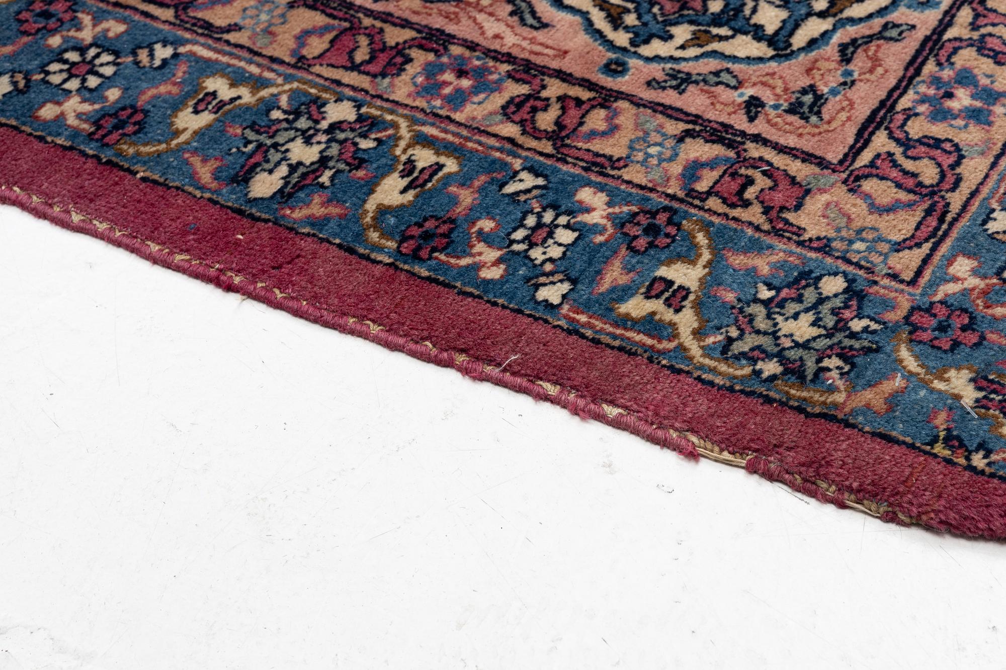 An antique Tabriz carpet, West Persia, c. 447 x 322 cm.