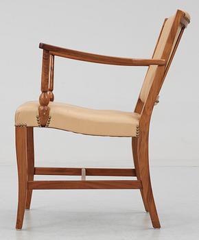 A Josef Frank valnut armchair by Svenskt Tenn.