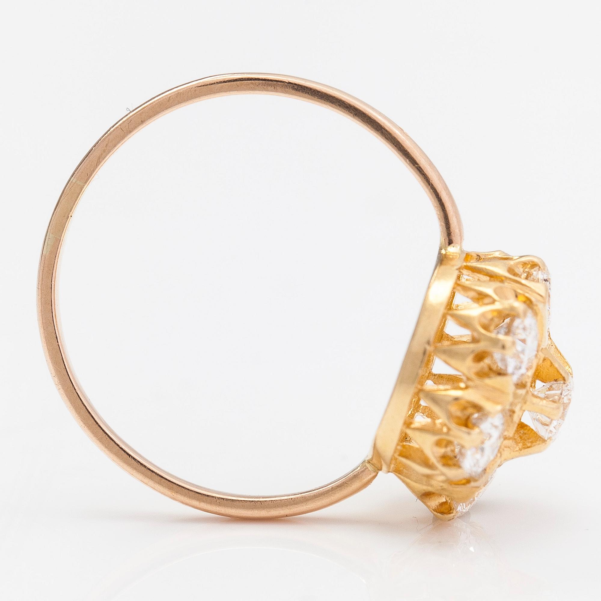 A 14K and 18K gold and diamond cluster ring ca 1.15 ct in total.