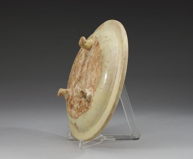 A sancai glazed tripod dish, Tang dynasty, (618-907 AD.).