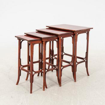 An early 19th century nest of four tables in stained beech from Thonet.