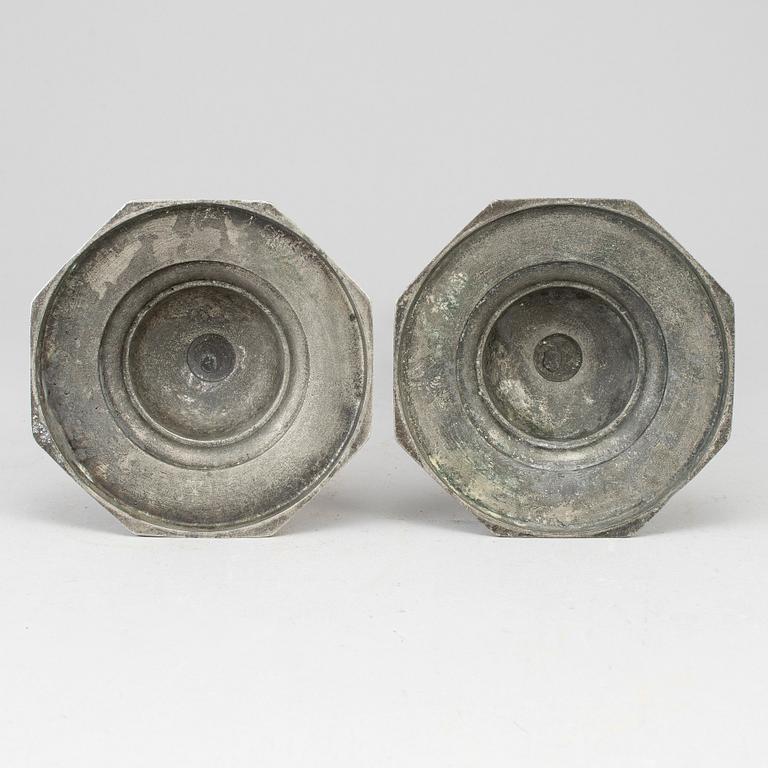 A pair of 18th century pewter candlesticks.