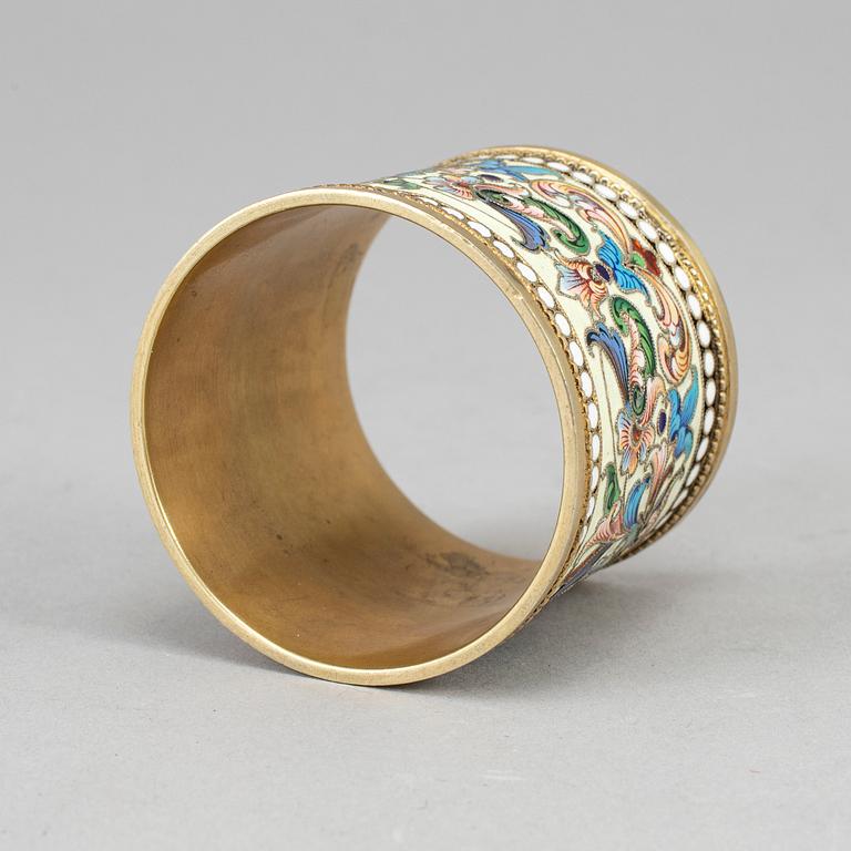 A Russian silver-gilt and cloisonné enamel napkin ring, unidentified makers mark, Moscow 1899-1908.
