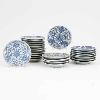 A set of 24 similar Chinese blue and white porcelain small dishes, late Qing dynasty, second half of the 19th Century.