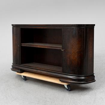 A 1930s stained birch shelf.