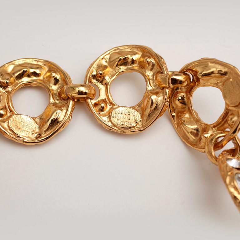EDOUARD RAMBAUD, a gold colored metal necklace with glasestones cut in various chapes.
