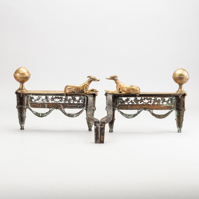 A pair of Louis XVI 18/19 century fire dogs.
