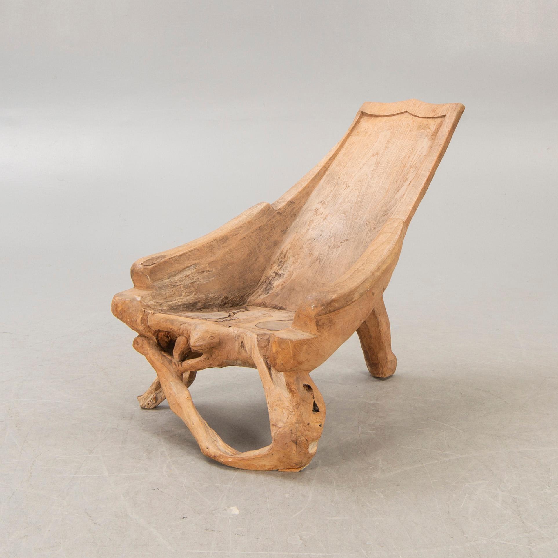 A late 20th century wooden armchair.