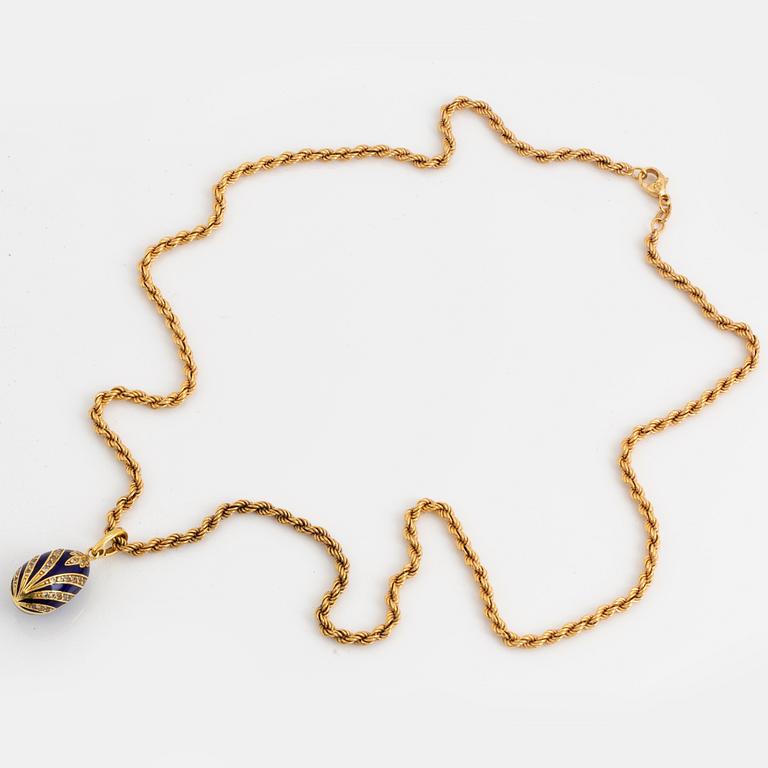 Egg pendant, gold, enamel with stones, with goldchain.