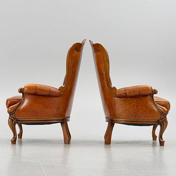 A pair of leather armchairs, second half of the 20th century.