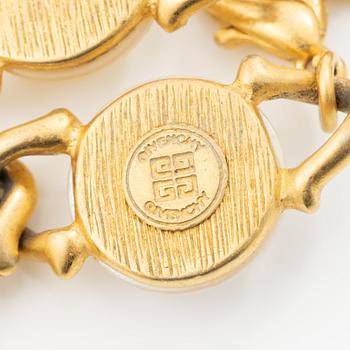 Givenchy, necklace, earrings and brooch.