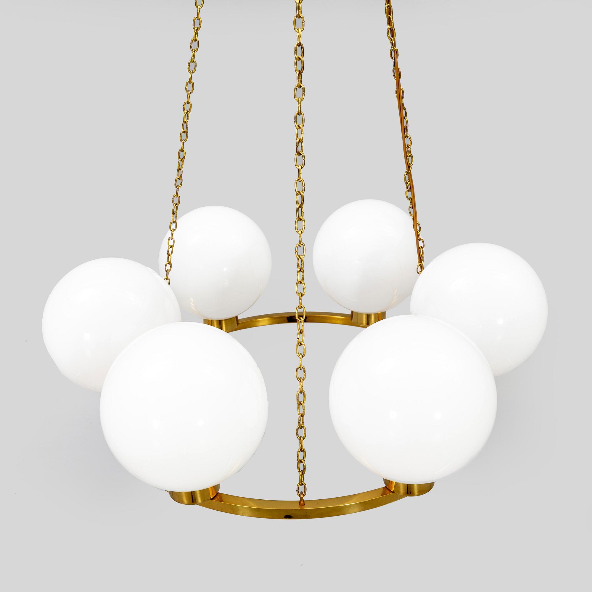 A mid 1900s brass ceiling ceiling pendant.