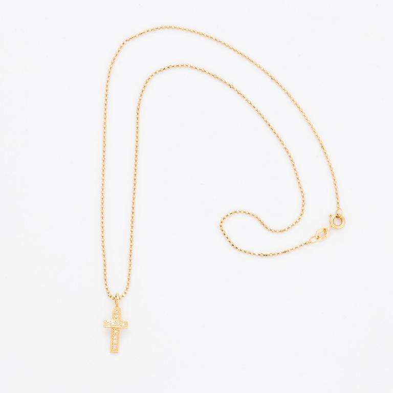 Efva Attling, 18K gold and brilliant-cut diamond cross pendant.
