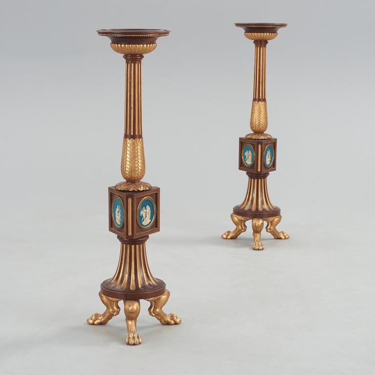 A pair of Empire 19th century candle stands.