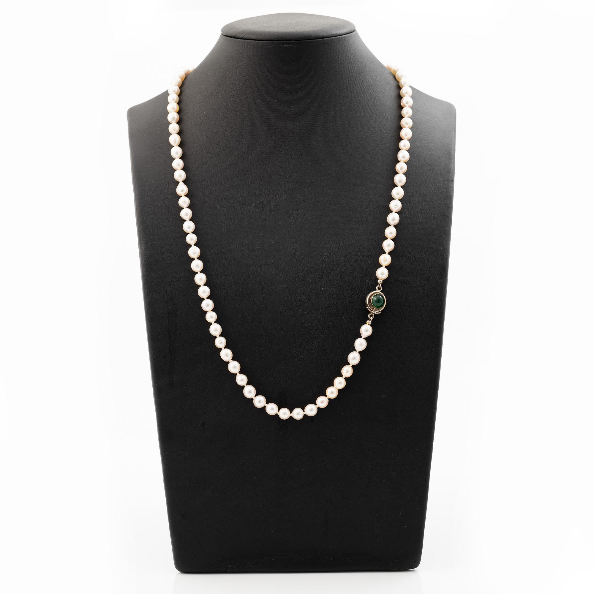 Cultured pearl necklace with Niels Erik From clasp, Denmark, silver set with a green cabochon-cut stone.