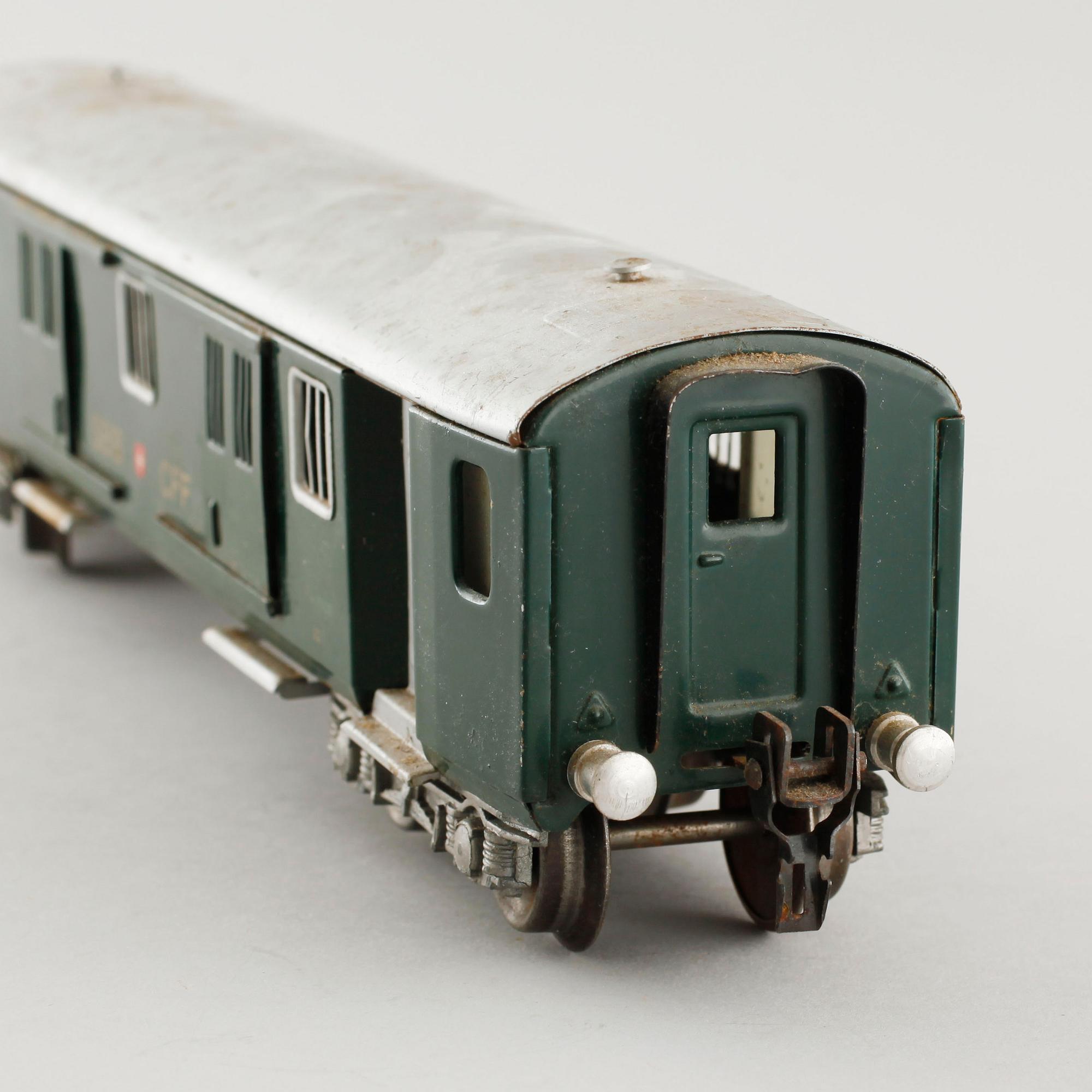 A 1940/50s model train set of 31 pcs in O-scale made by HAG, Switzerland.