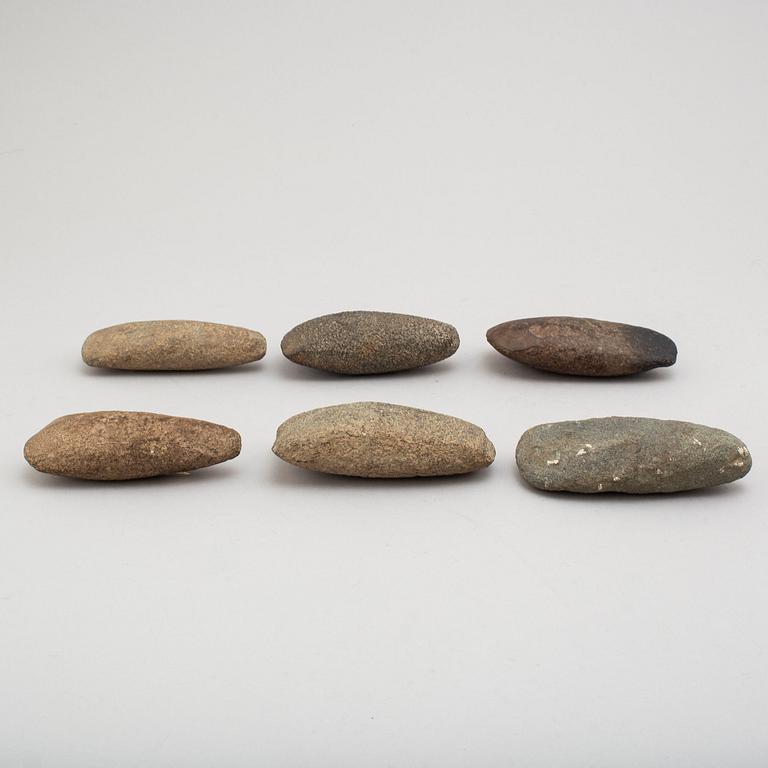 Six neolithic stone axes.