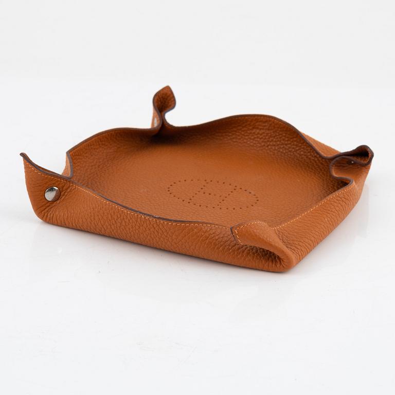 Hermès, an orange Clemence 'Mises et Relances' change tray, 2012.