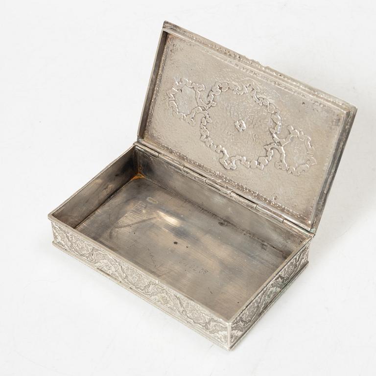 A Persian silver cigarett box, first half of the 20th century. Total weight 266 grams.