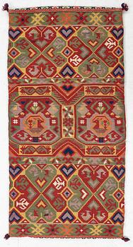 A double-interlocked tapestry carrige cushion, c 100 x 50 cm, Scania, mid 19th century.