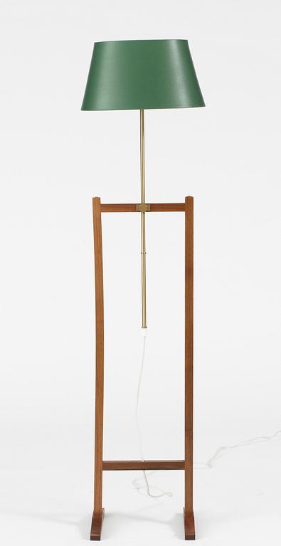 A Josef Frank walnut and brass floor lamp, Firma Svenskt Tenn.