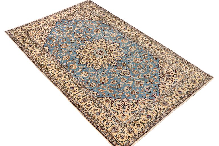 A Nain, part silk carpet, c. 196 x 120 cm.