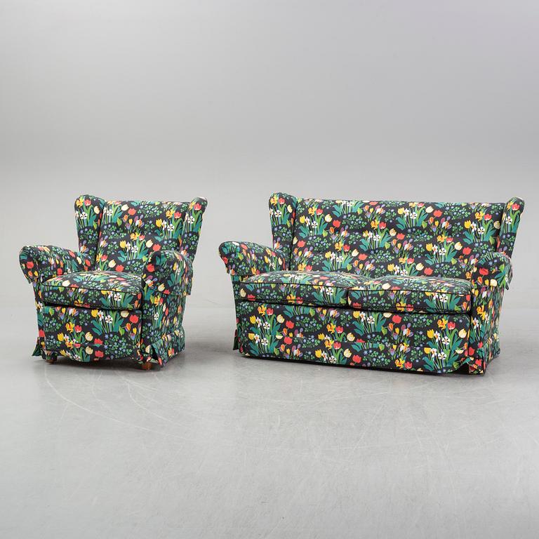 A sofa and wingback chair, later part of the 20th Century.