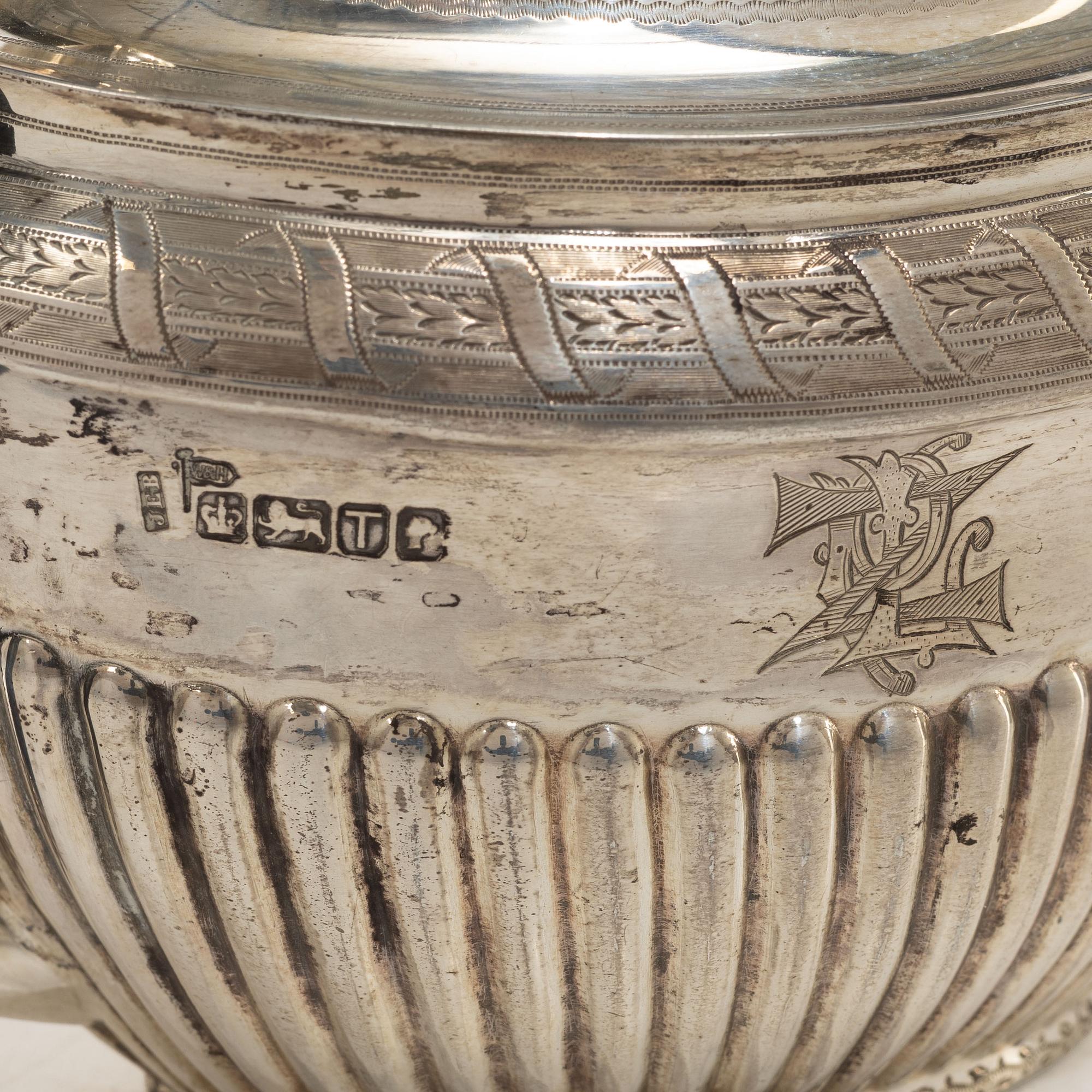 An English silver teapot, mark of Walker & Hall (John Edward Bingham), Sheffield, 1886.