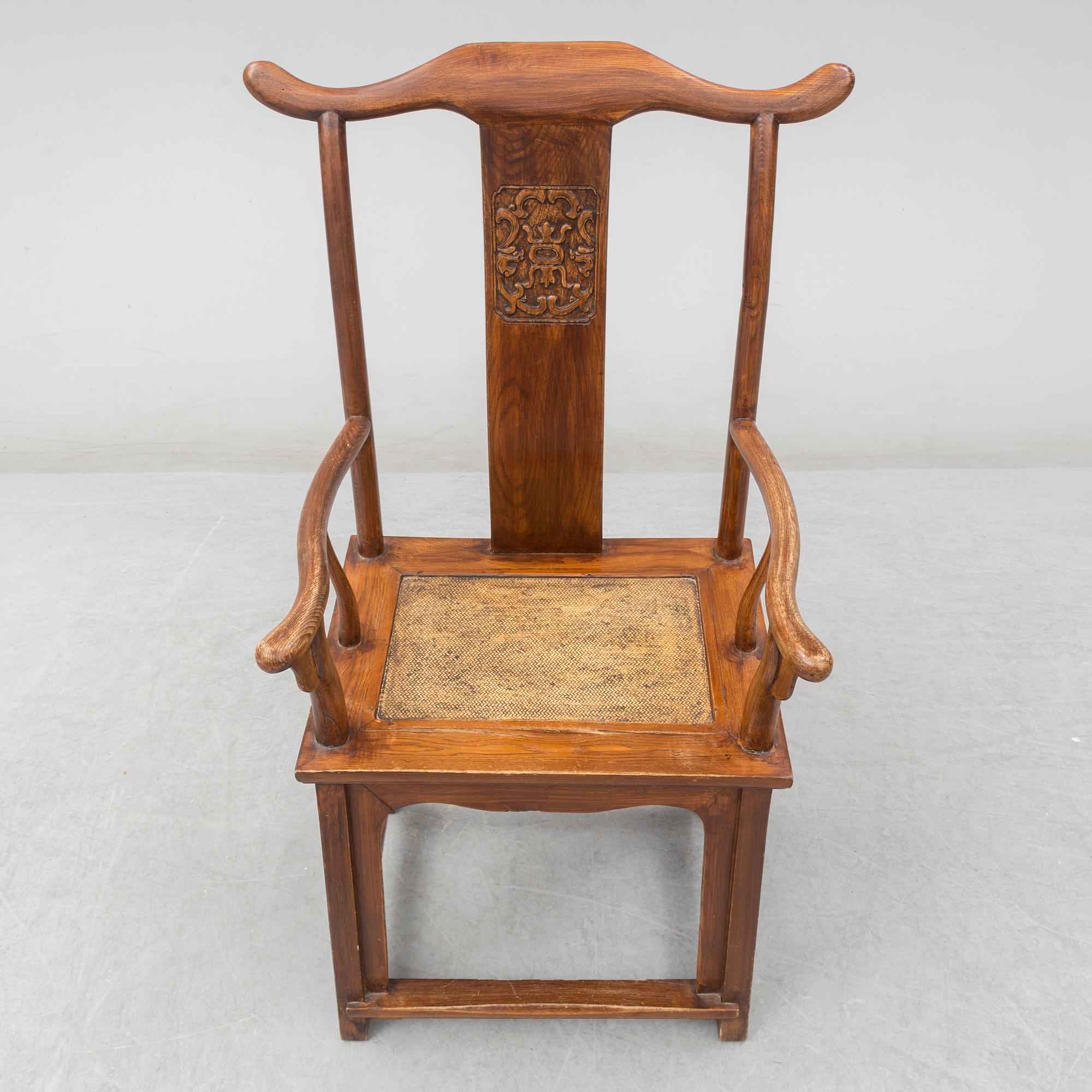 A Chinese wooden armchair, 20th century.