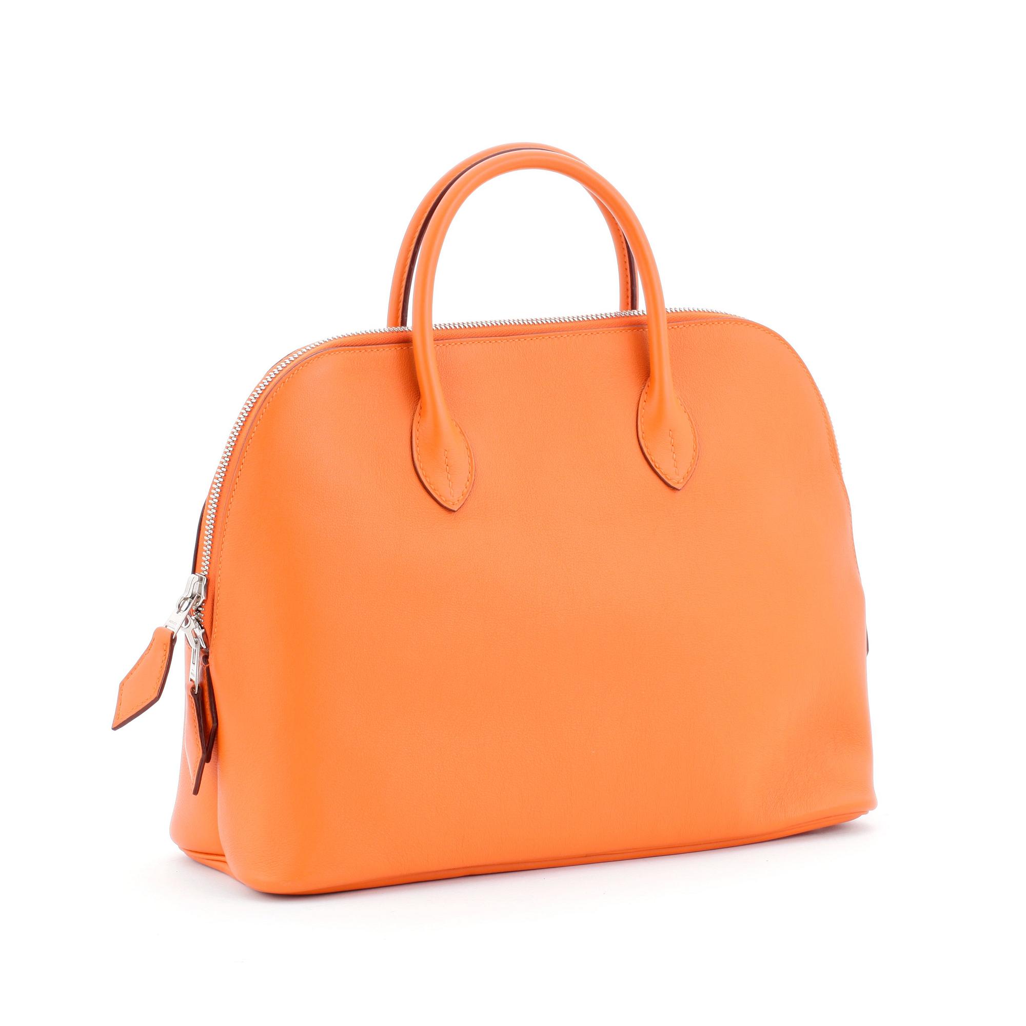 HERMÈS, a orange calf leather handbag, "Bolide".