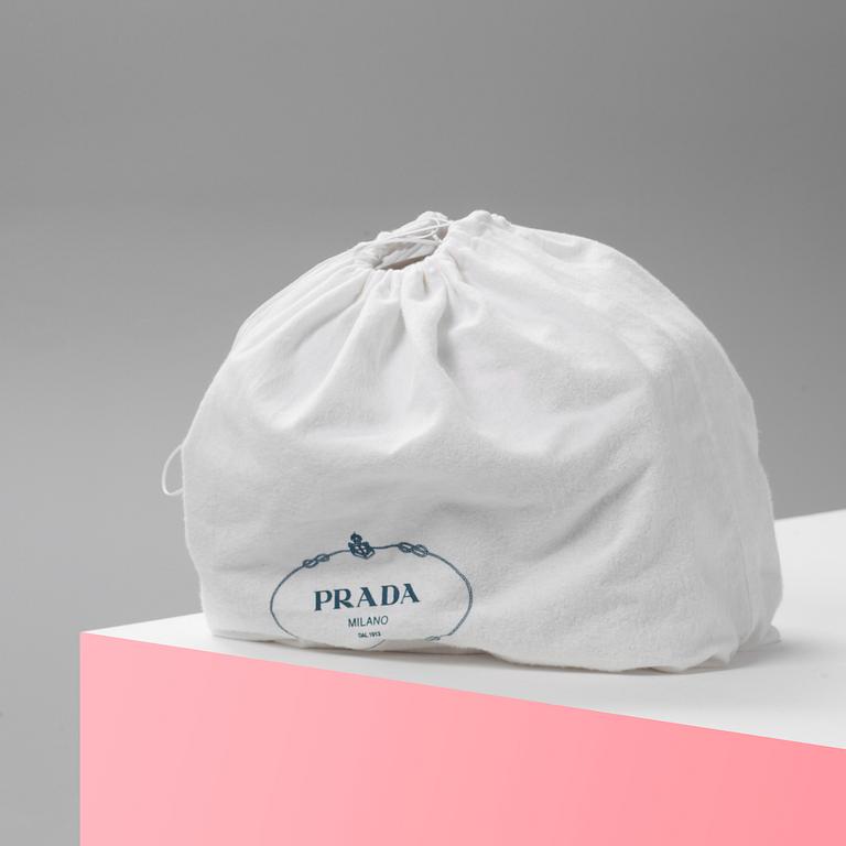 A leather handbag by Prada.