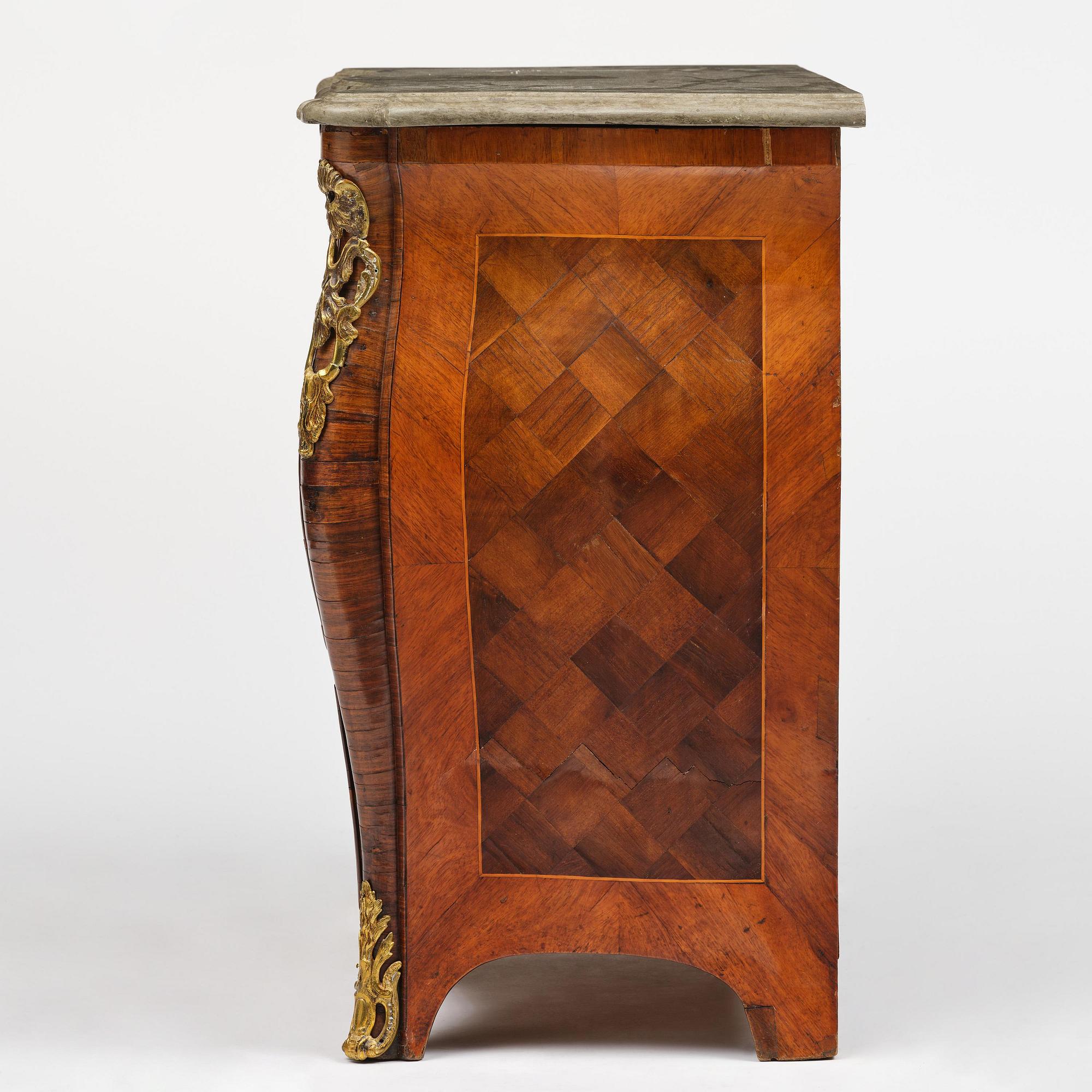 A rococo parquetry commode by C. Linning (master in Stockholm 1744-79).