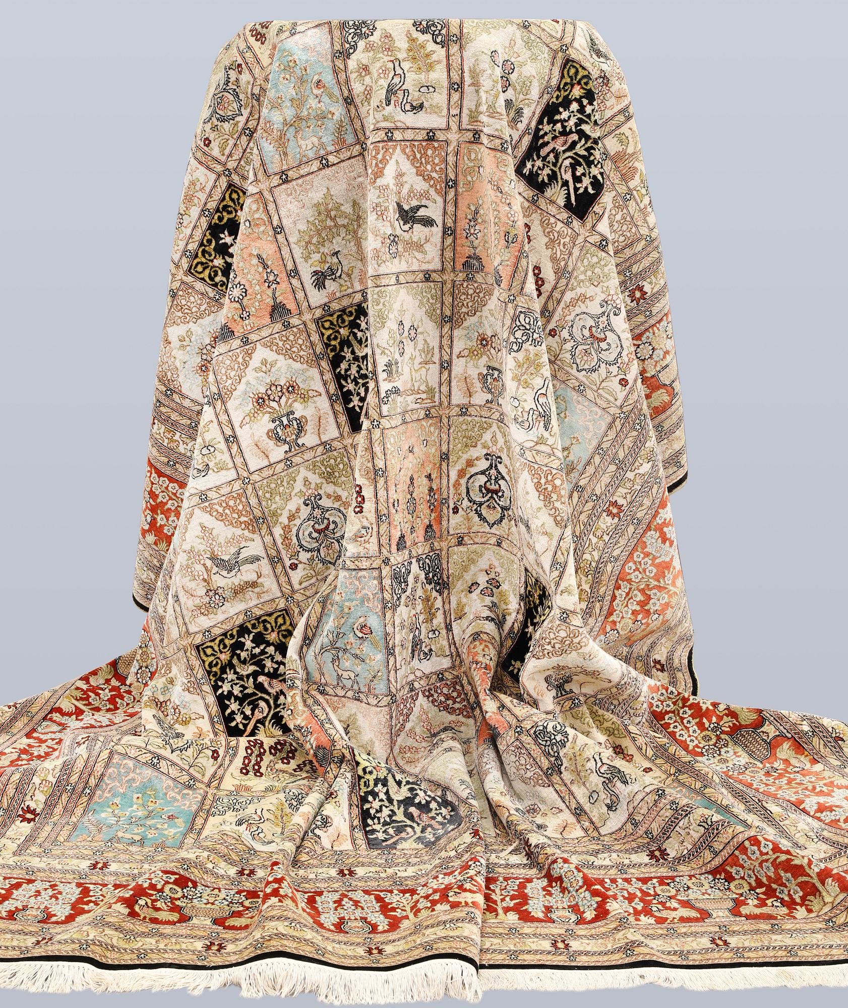An oriental silk carpet, approx. 376 x 274 cm.