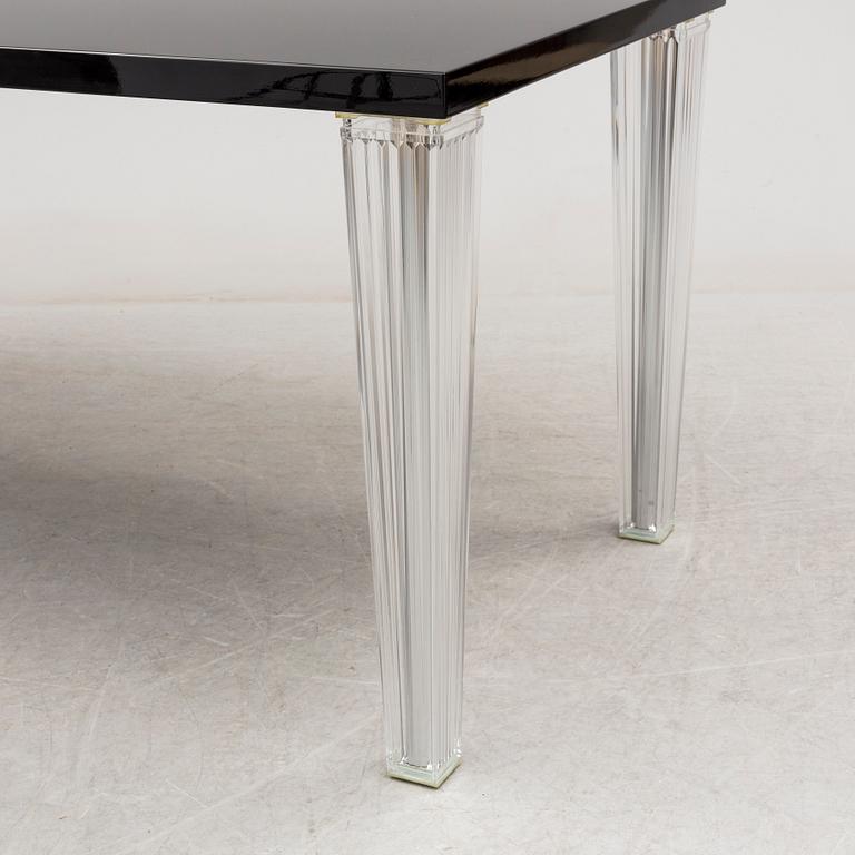 A "Tip Top" dining table by Philippe Starck for Kartell.