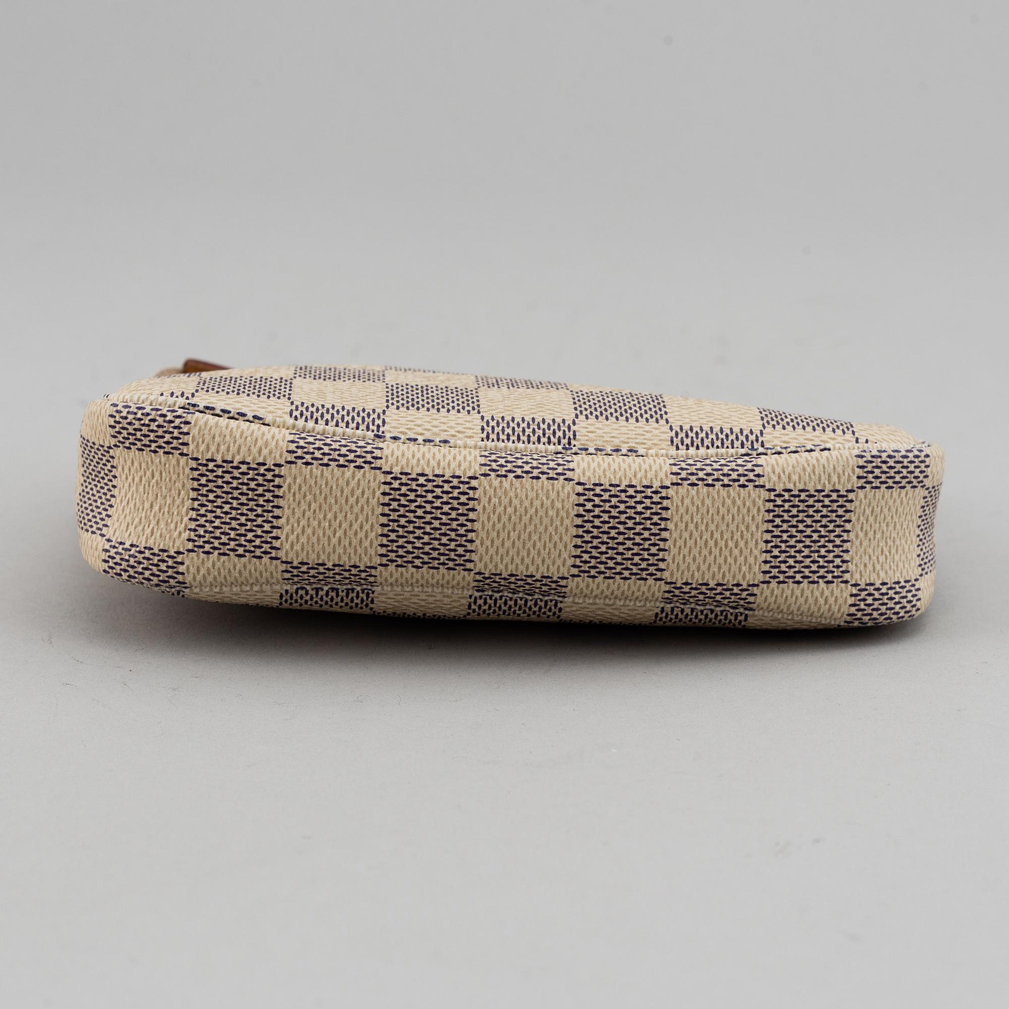 LOUIS VUITTON, A 'Mini Pochette Accessoires' and a shoulder strap.