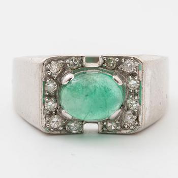 Ring with cabochon-cut emerald and single-cut diamonds.