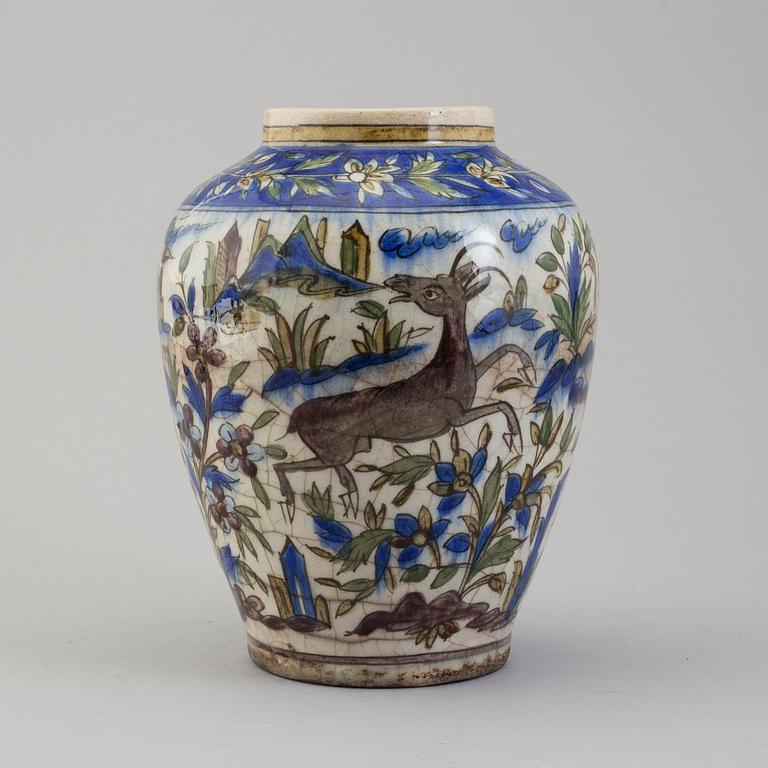 A POTTERY URN, probably late Qajar dynasty, Persia/Iran, height ca 27,5 cm.