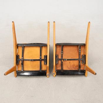 Östen Kristiansson armchairs, a pair of "Jaktstol/Vilstol 204" Luxus, Vittsjö, second half of the 20th century.