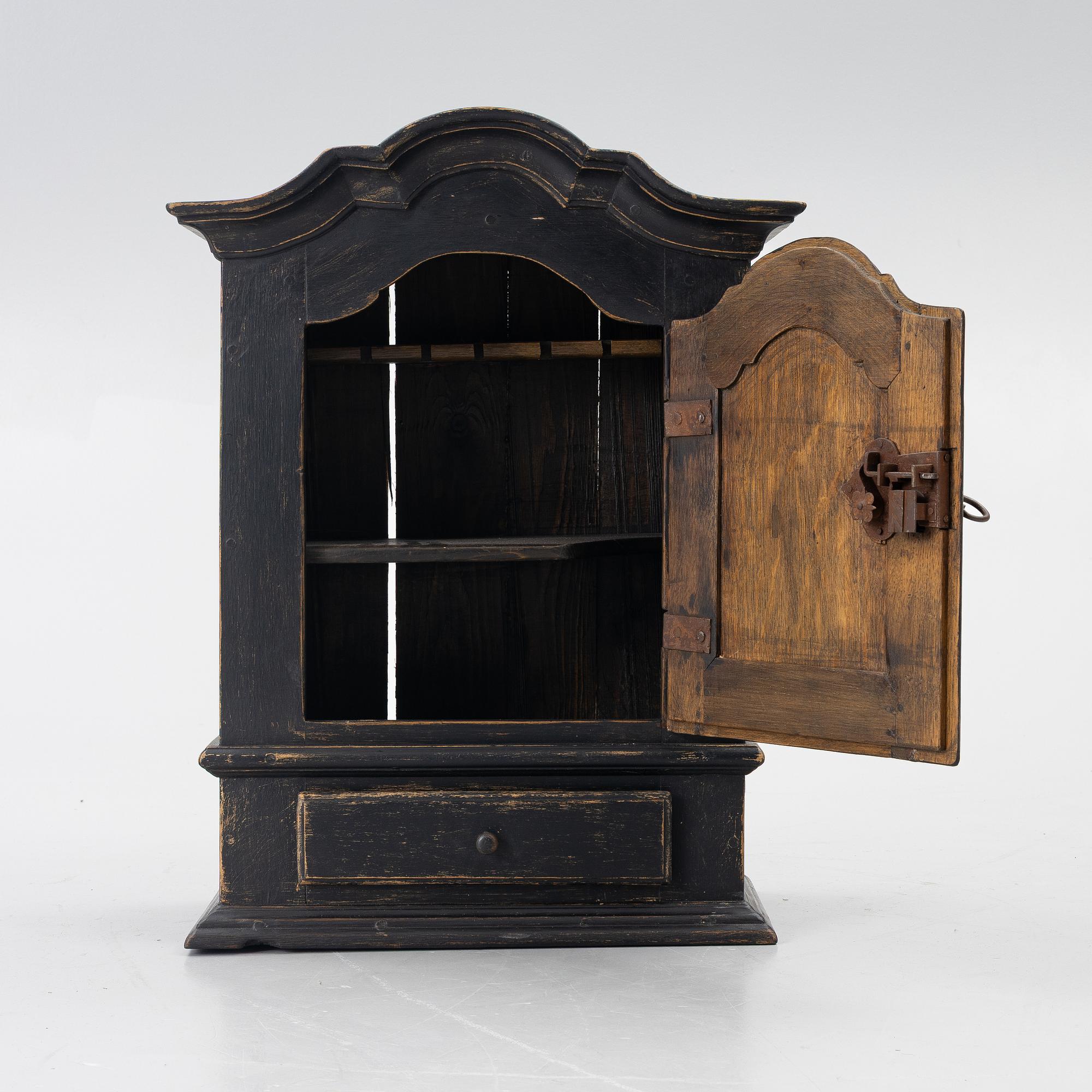 A Baroque wall cabinet, 18th Century.