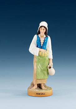 1346. A Russian bisquit figure of a Bulgarian woman, Gardner manufactory, ca 1900.