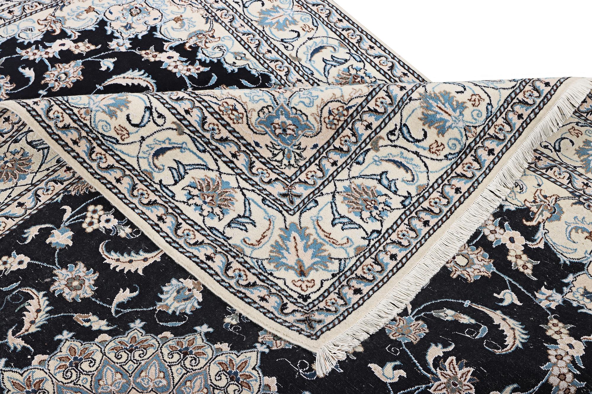 A Nain carpet, part silk, c. 286 x 206 cm.