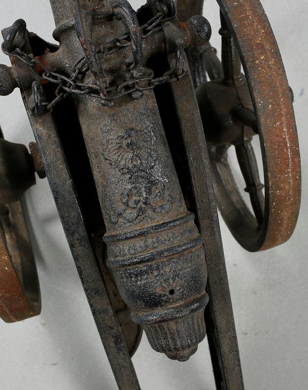 A small cast iron cannon, 19th or early 20th century.