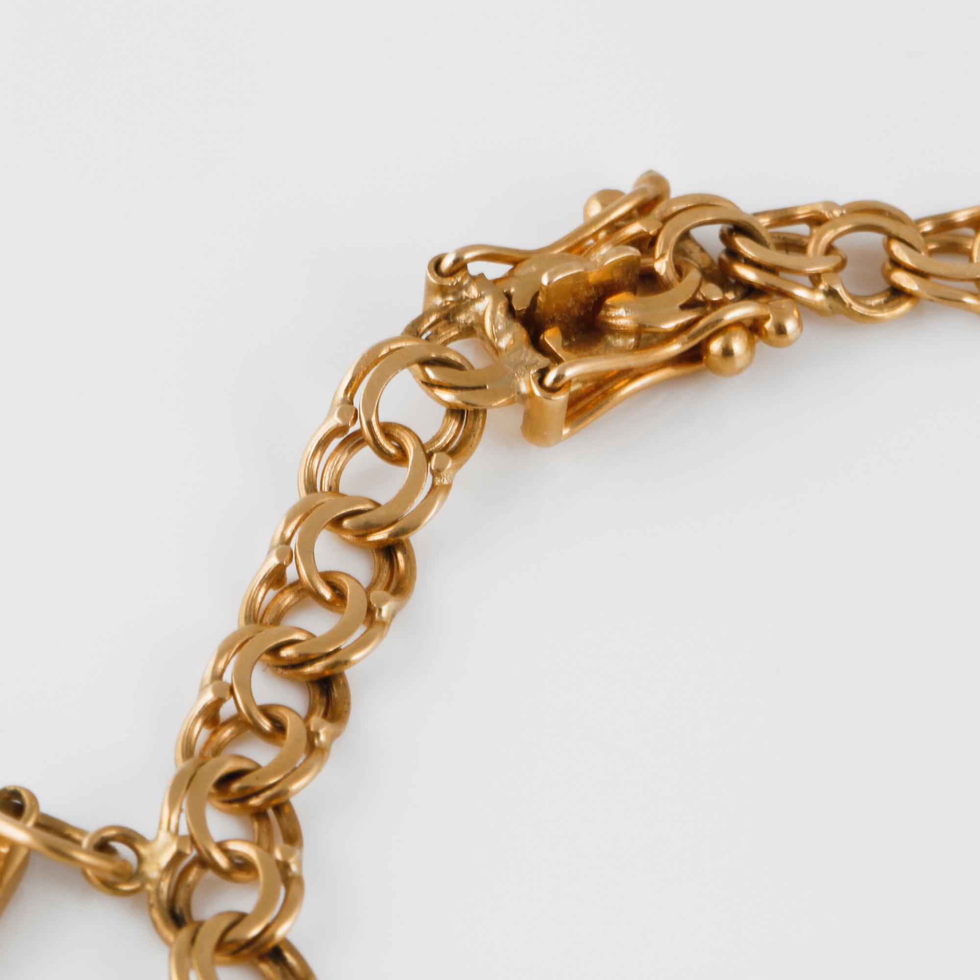 ARMBAND med 4 BERLOCKER, 18K guld, Mary Kvoch, Stockholm, 1959. Vikt 10,7 gram.