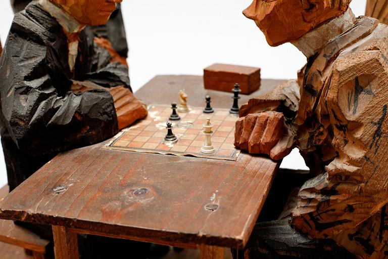 AXEL PETERSSON DÖDERHULTARN, sculpture group, partially painted carved wood, Chess players, stamp signed.