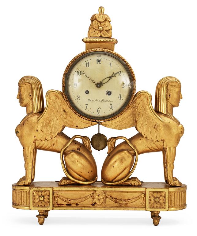 A late Gustavian gilt wood mantel clock by W. Pauli.