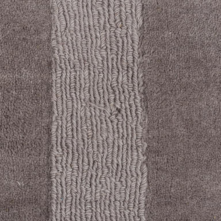 A Layered "Wool Cubes" carpet, 390x620 cm.