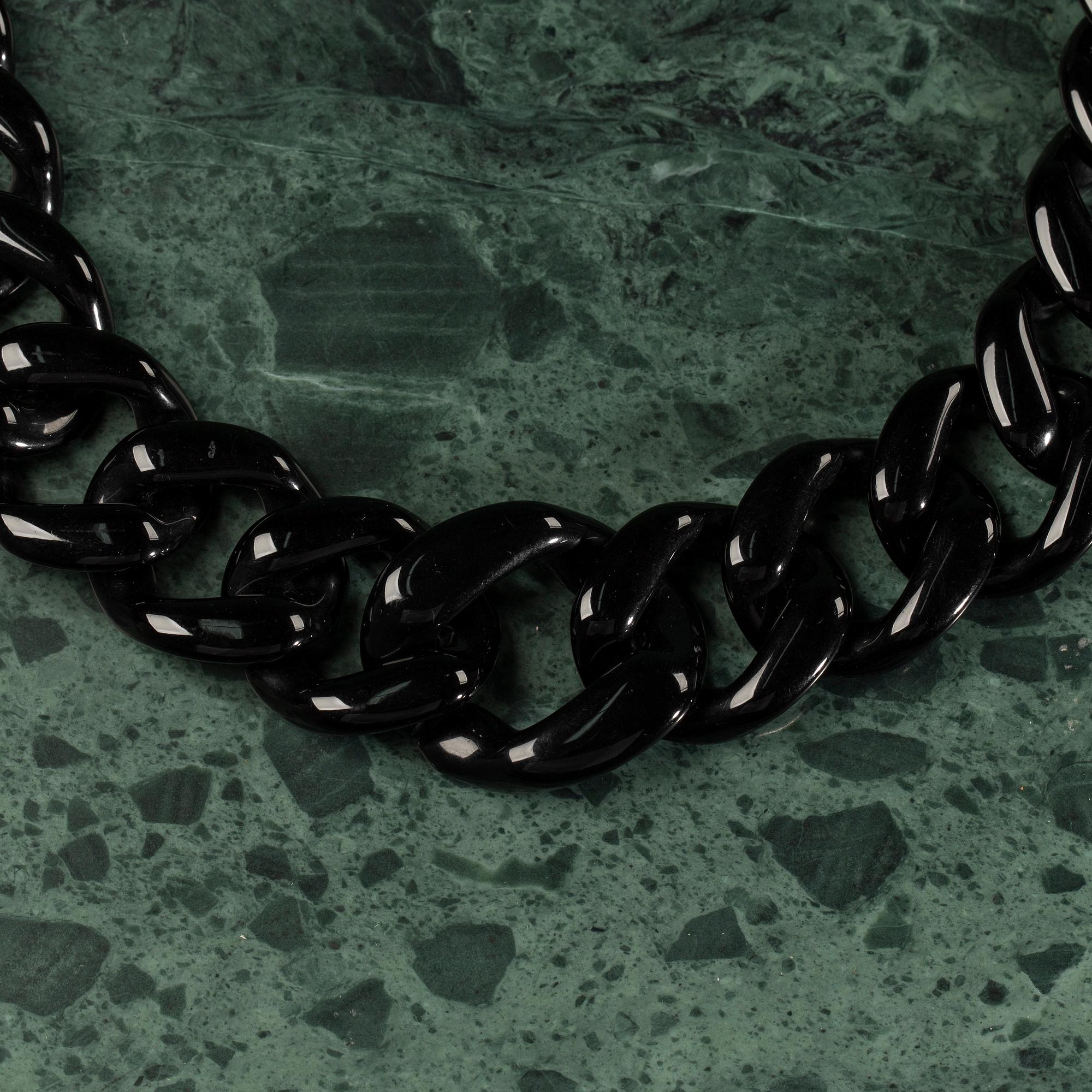 A necklace by PRADA.