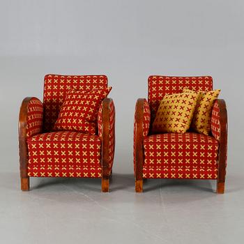 A pair of 1930s armchairs.